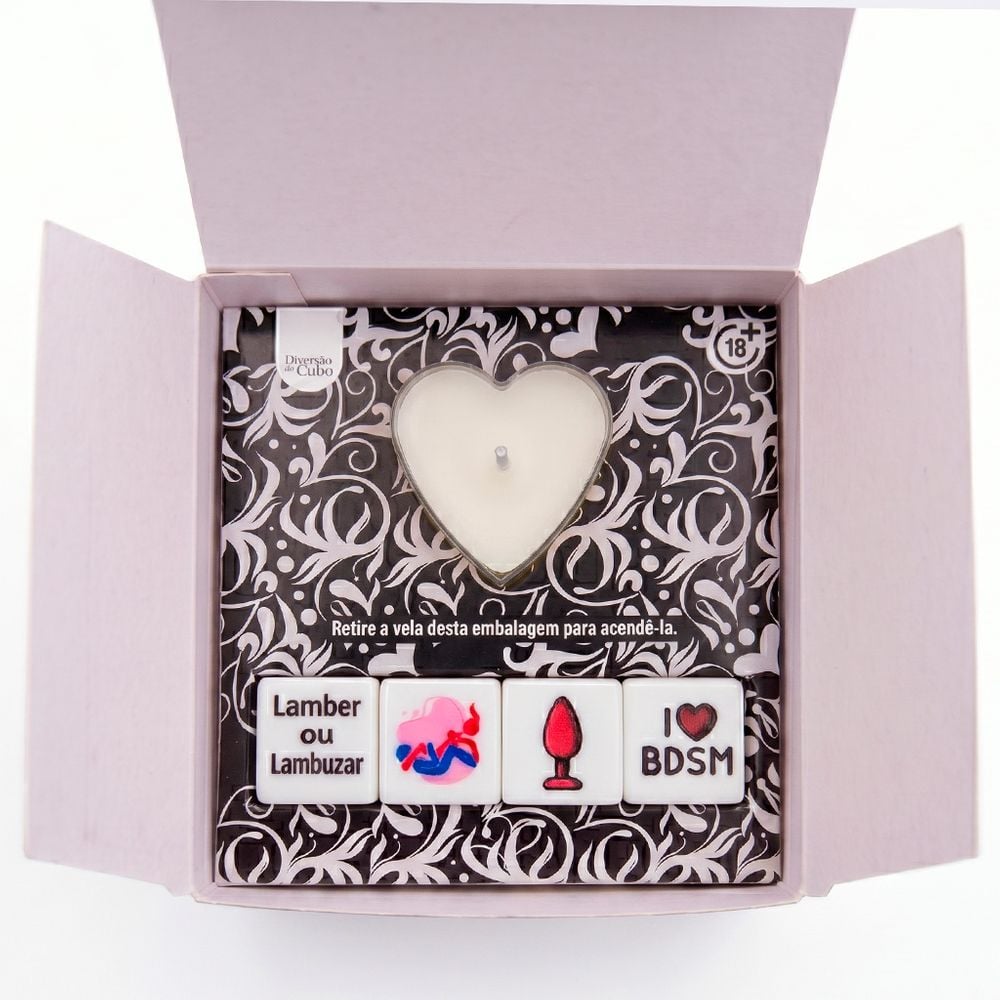 Jogo & Sedução BDSM com 4 dados temáticos e vela aromática para explorar fantasias e dinâmicas de dominação a dois. Confira na FeelHot.
